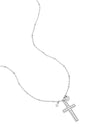 Necklace with decorated cross pendant and charms