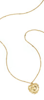 Necklace with flat details and large pendant