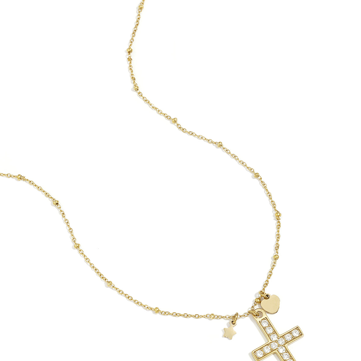 Necklace with decorated cross pendant and charms