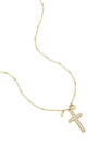 Necklace with decorated cross pendant and charms