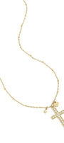 Necklace with decorated cross pendant and charms